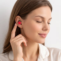 Red-04 | High-Fidelity Washable Silicone Ear Plugs, worn, touching closeup