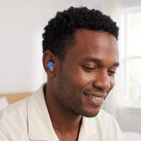 Blue-04 | High-Fidelity Washable Silicone Ear Plugs, worn, smile closeup
