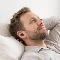 Black-04 | High-Fidelity Washable Silicone Ear Plugs, worn, hand behind head