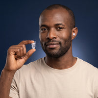 White | High-Fidelity Concert Ear Plugs with Case, worn, man holding