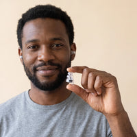 Black | High-Fidelity Concert Ear Plugs with Case, worn, man holding
