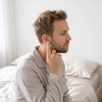 Red-05 | High-Fidelity Washable Silicone Ear Plugs, worn, bed edge profile