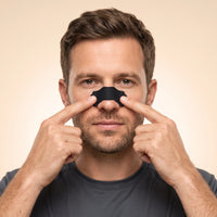 Sports Nasal Strips with Enhanced Adhesion, man applying a nasal strip
