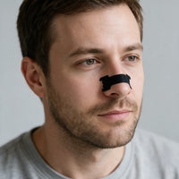 Extra Strength Anti-Snoring Nasal Strips, man wearing a nasal strip