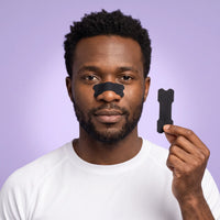 Sports Nasal Strips with Enhanced Adhesion, man holding a nasal strip