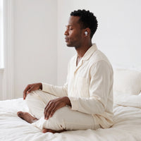 White-04 | High-Fidelity Washable Silicone Ear Plugs, worn, meditating profile