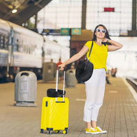 All colors | Fillable Velvet Travel Pillow with Storage Bag, woman with luggage at train station