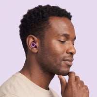 Purple 1 | Quiet Silicone Ear Plugs for Sleep & Motorcycling, worn, man portrait