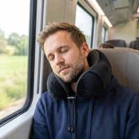 Black | U-Shaped Memory Foam Airplane Neck Pillow, man sleeping on a train