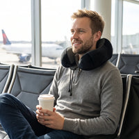 Black | U-Shaped Memory Foam Airplane Neck Pillow, man with coffee at the airport gate