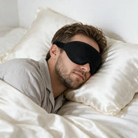 black | 3D Concave Cup Blackout Sleep Mask, man sleeping on his side, silk pillow