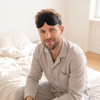 black | 3D Concave Cup Blackout Sleep Mask, man with the mask on his forehead
