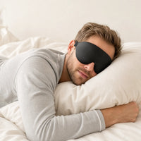 black | 3D Concave Cup Blackout Sleep Mask, man sleeping on his stomach hugging a pillow