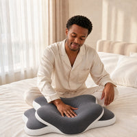 DARK GRAY | Butterfly Dual-Height Cervical Pillow, man pressing the soft memory foam with his hand