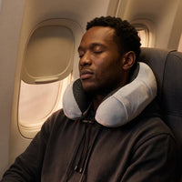 Grey | U-Shaped Memory Foam Airplane Neck Pillow, man sleeping on a night flight