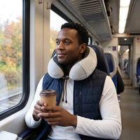 Grey | U-Shaped Memory Foam Airplane Neck Pillow, man with coffee on a train