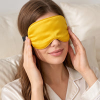 Golden Yellow | Soft Silk Blackout Sleep Mask, worn, close up pressing