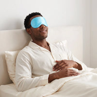 Sky Blue | Soft Silk Blackout Sleep Mask, worn, headboard relax