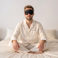 Black | Soft Silk Blackout Sleep Mask, worn, cross legged
