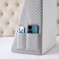 White and Gray | Foam Wedge Pillow for Elevated Sleeping, pocket holding a remote and a phone, close-up